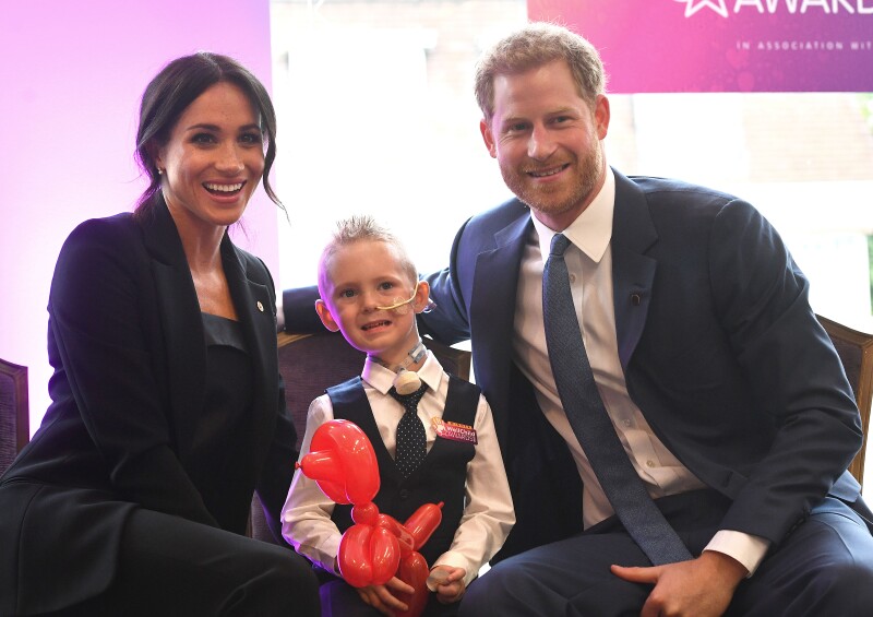 Harry y Meghan con niño en Well Child 2018