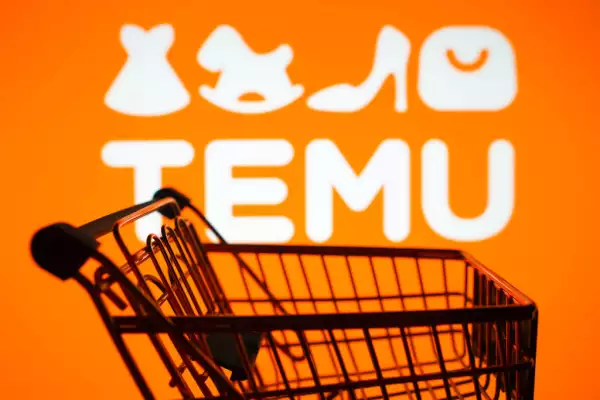 In this photo illustration, the Temu logo seen displayed on