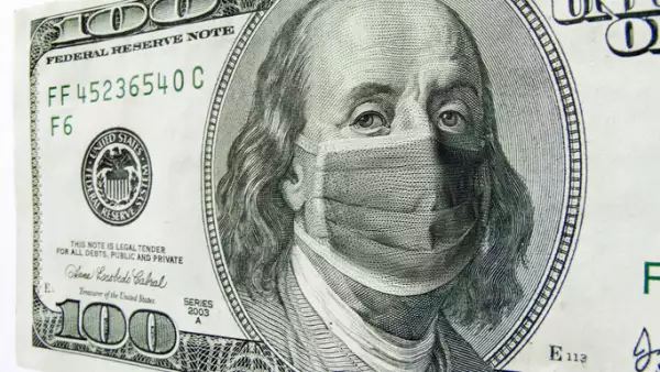 Ben Franklin wearing a Coronavirus Healthcare Mask on One Hundred Dollar Bill.