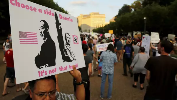 People gather for a vigil in response to the death of a counter-demonstrator