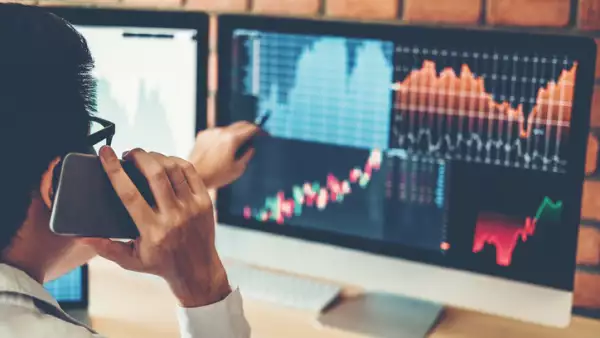 Investment stock market  Entrepreneur Business Man discussing and analysis graph stock market trading,stock chart concept