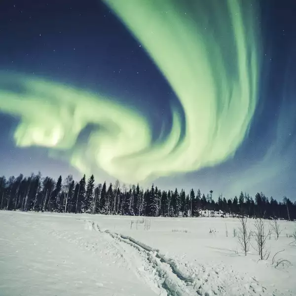 An aurora is seen in the sky in Rovaniemi