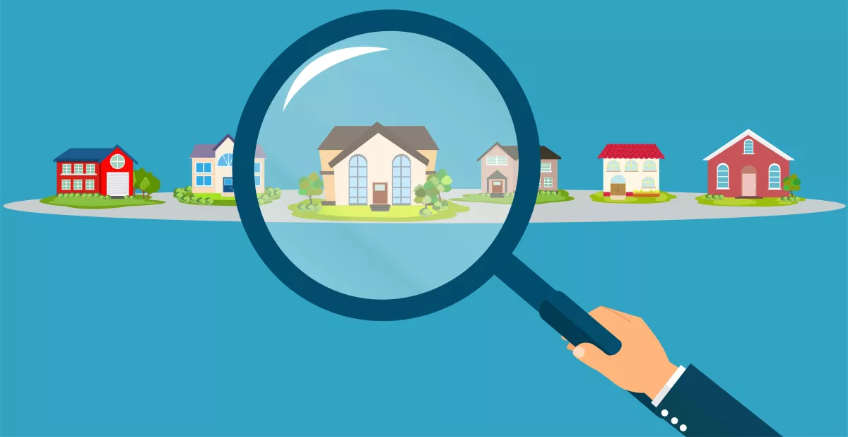 Vector of a business man hand holding magnifying glass searching for the best real estate house deal