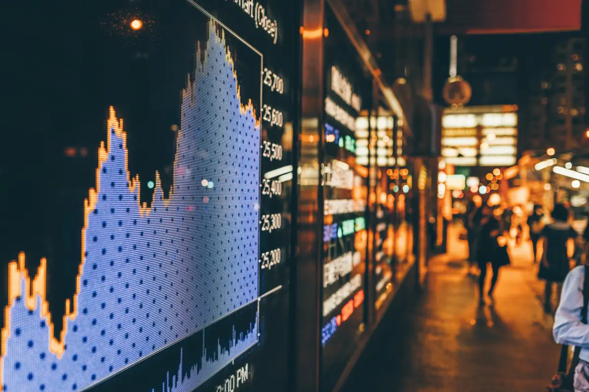 Financial stock market numbers and city light reflection