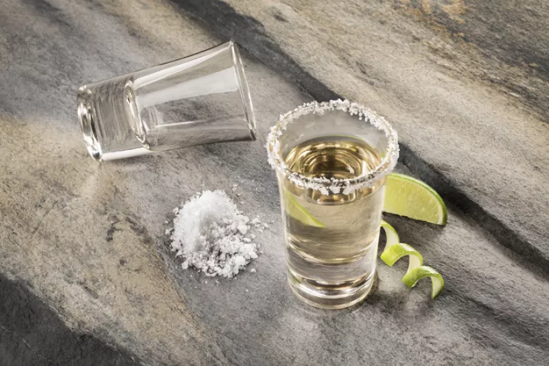 Mexican traditional drink accompanied with lime and salt