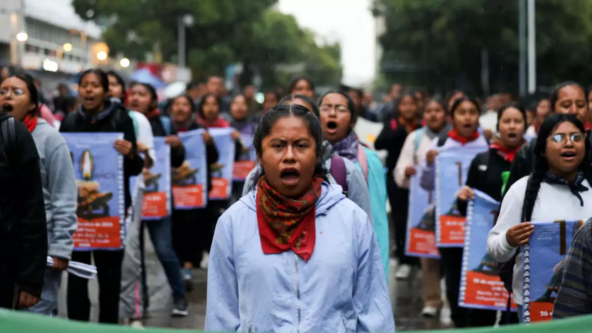 Demonstrators march to demand justice for the disappearance of student teachers in Mexico City