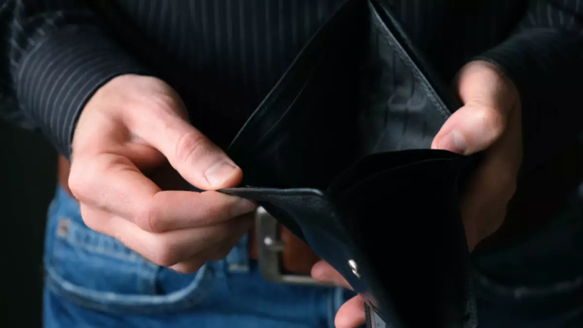 Empty Wallet In Male Businessman Hands