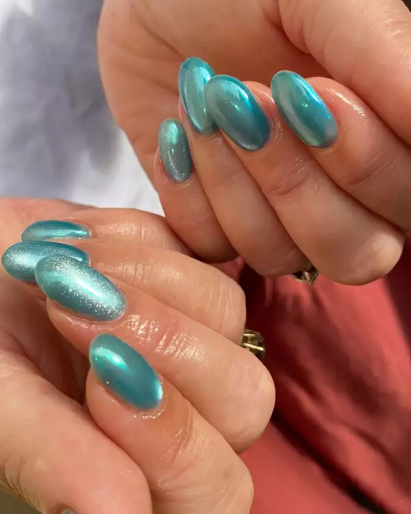 teal blue + cat eye nails.jpg