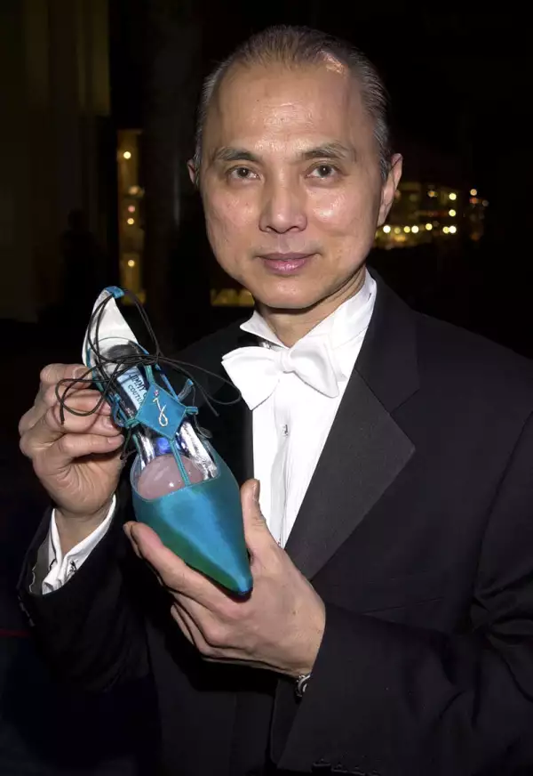 JIMMY CHOO AND SHOE WITH DIAMONDS AT THE JIMMY CHOO GALA FOR TOMMY CAMPAIGN AT THE VICTORIA AND ALBERT MUSEUM LONDON, BRITAIN - 08/03/01