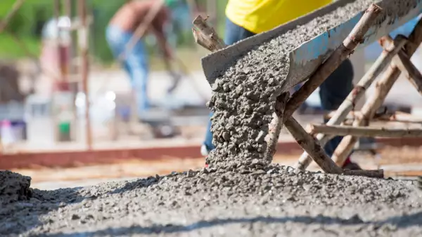 Concrete pouring during commercial concreting floors of building