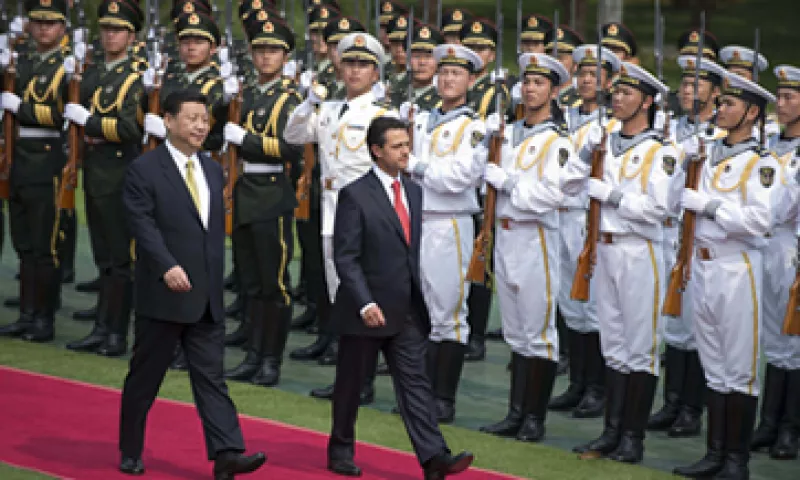 El presidente Peña Nieto tuvo su primer encuentro oficial con su homólogo chino, Xi Jinping (izquierda).(Foto: AP)