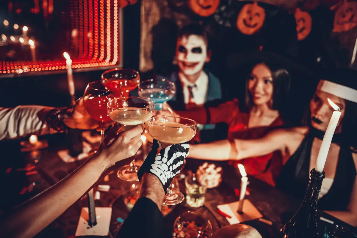 People in Costumes Clinking Glasses