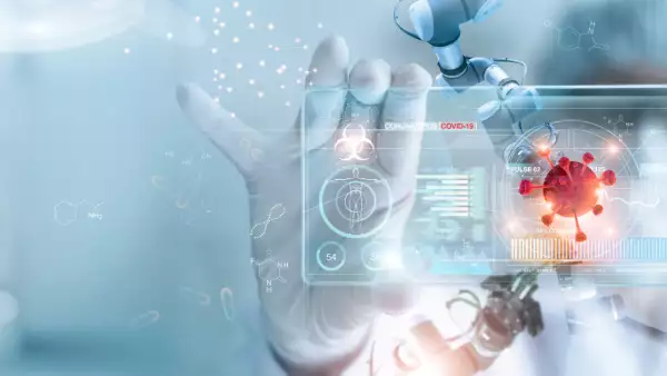 Una persona manipula un holograma con gráficos digitales.