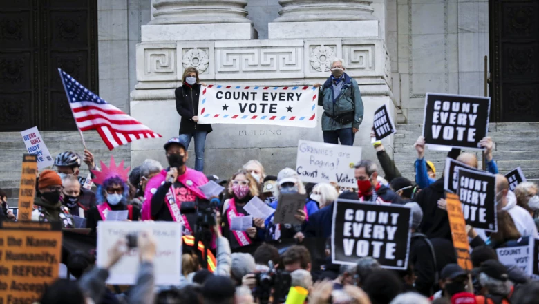 People attend a rally at the New York Public Library, the day after Election day, in Manhattan