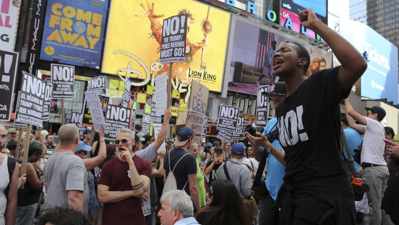 People gather for a vigil in response to the death of a counter-demonstrator