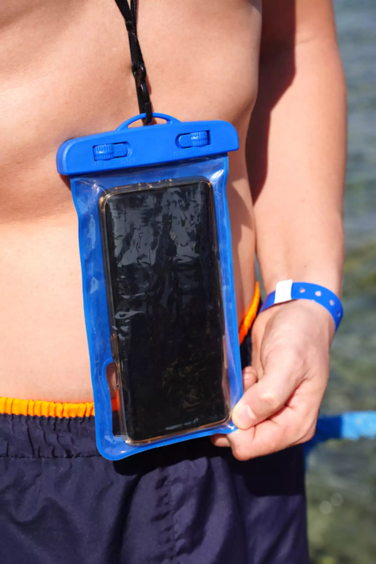 Blue waterproof smartphone case for taking pictures underwater