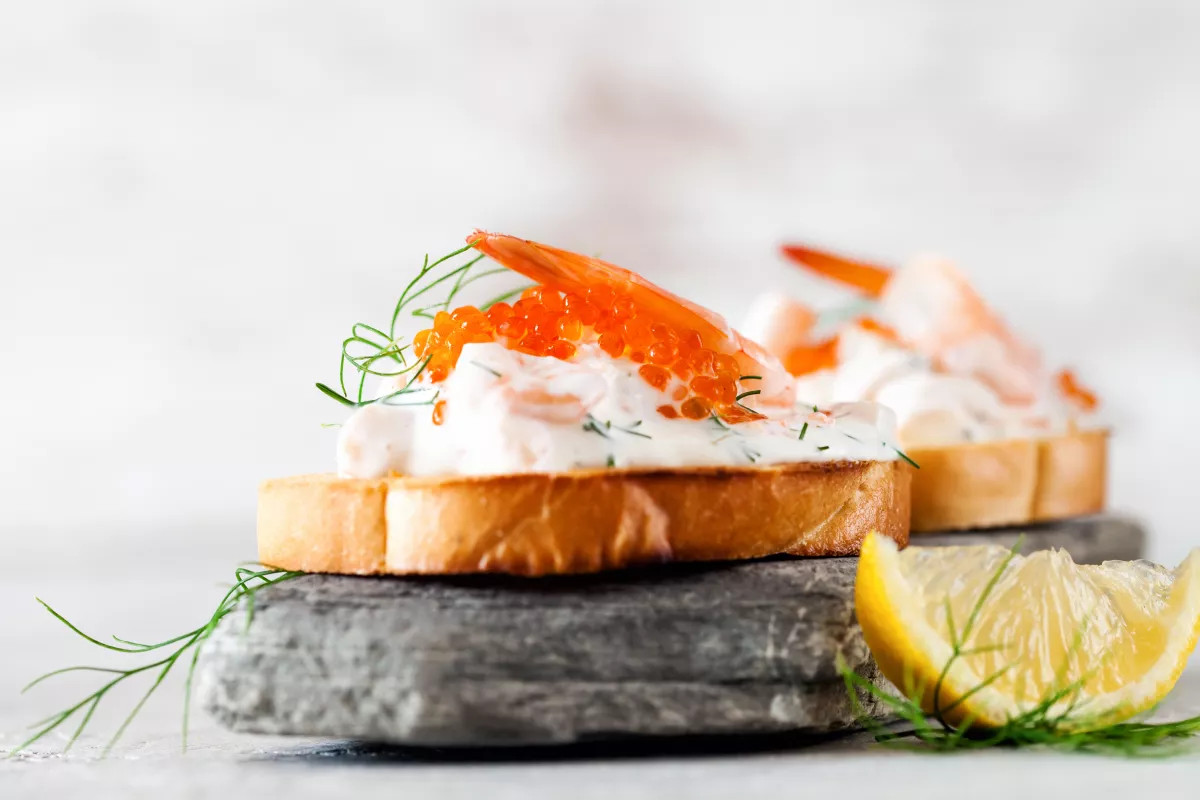 Toast skagen - shrimp and caviar on toast. Classic swedish appetizer. Selective focus. Copy space