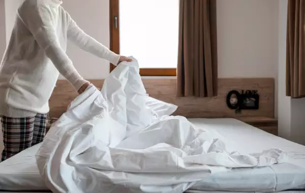 changing bed sheets