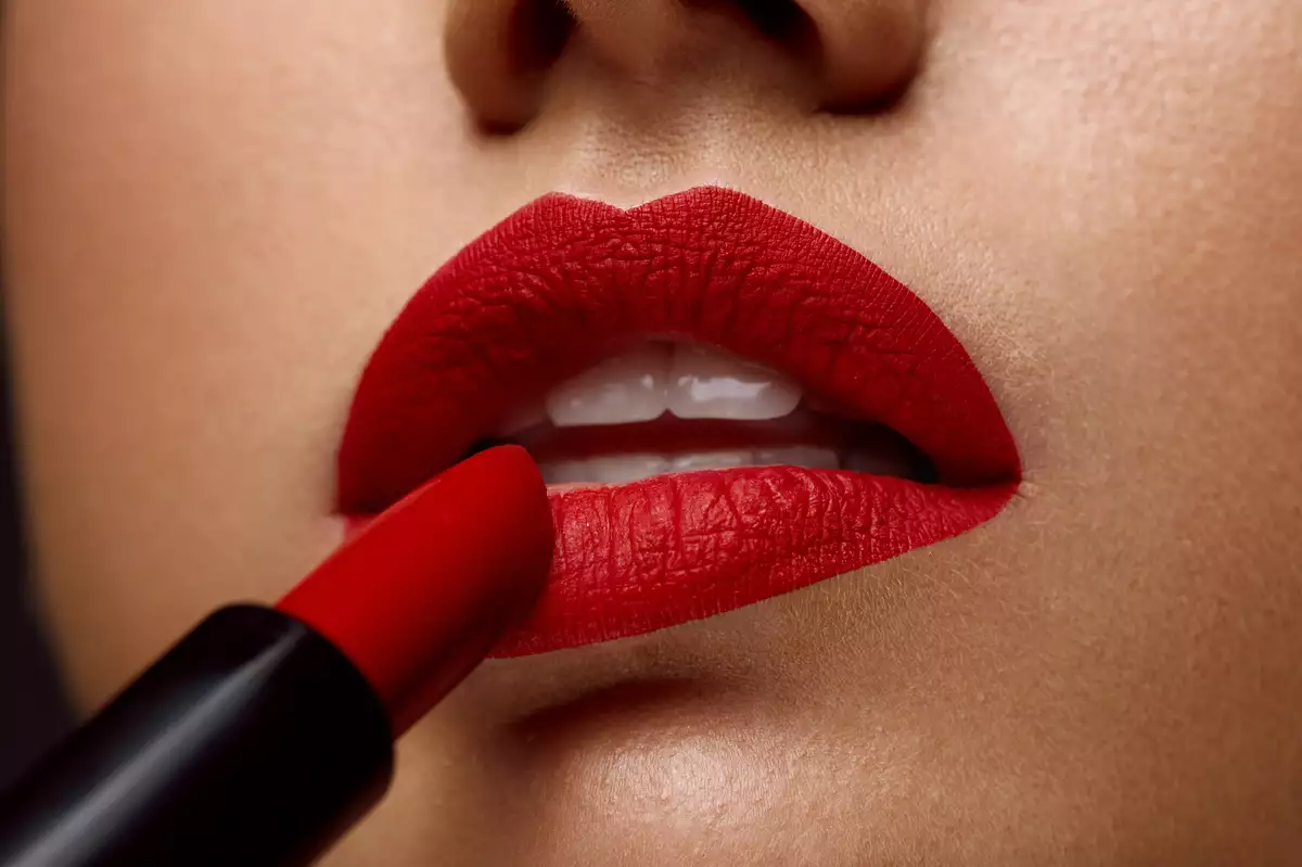 Red Lipstick. Closeup Of Woman Face With Bright Lips Makeup