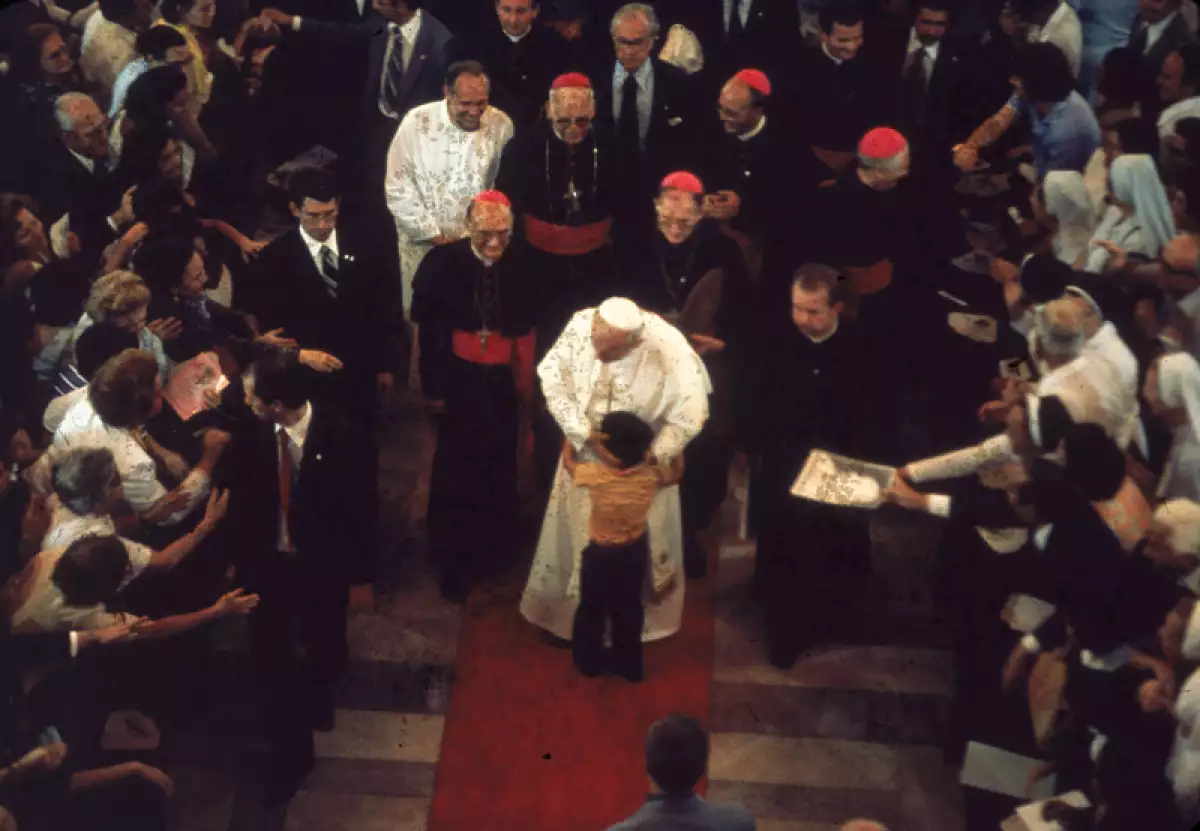 John Paul II Embraces Child
