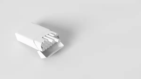 Pack of cigarettes fully toned in white color and isolated on white background