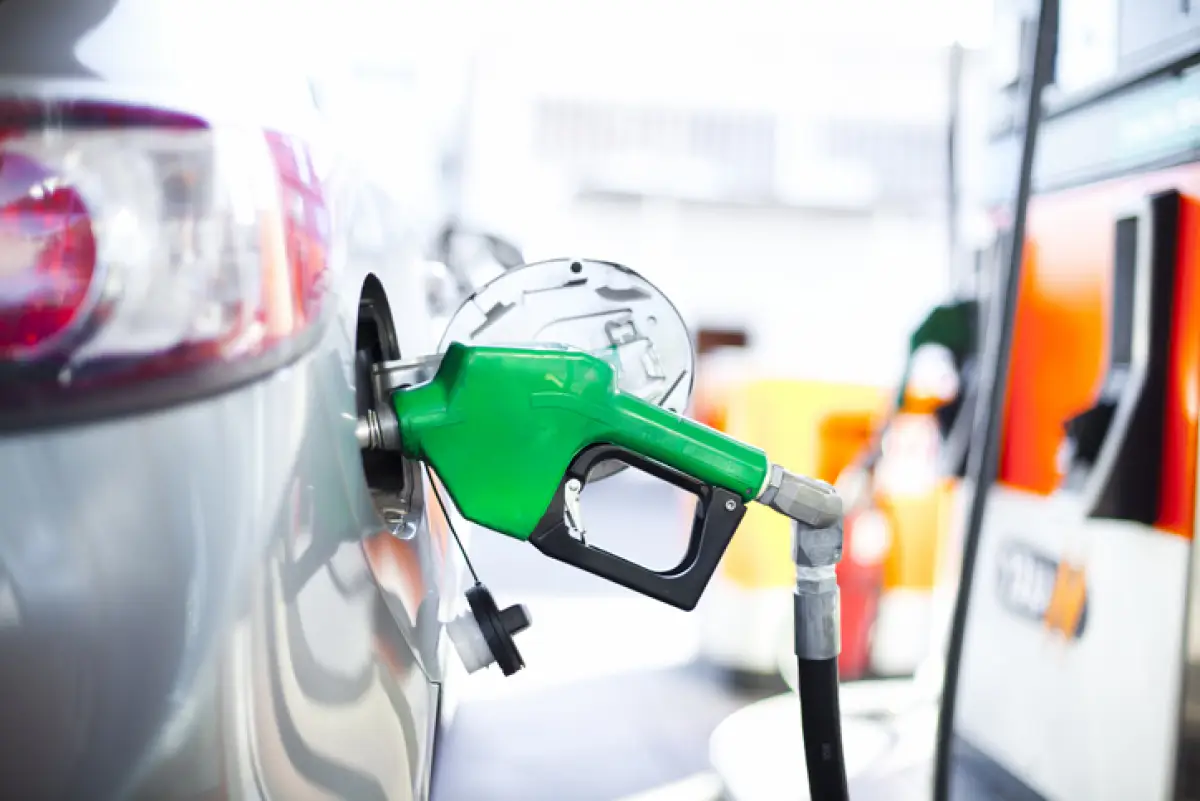 A close-up of a car being filled with gas