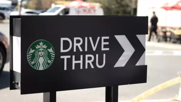 Cars lining up to order food using drive-thru facilitiy at local Starbucks Coffee Shop