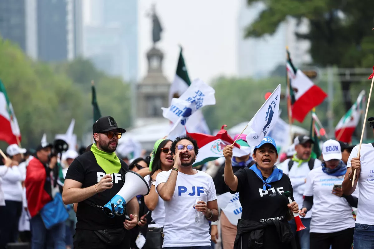 People protest as Mexico's Senate debates a highly contested proposal on a judicial reform, in Mexico City