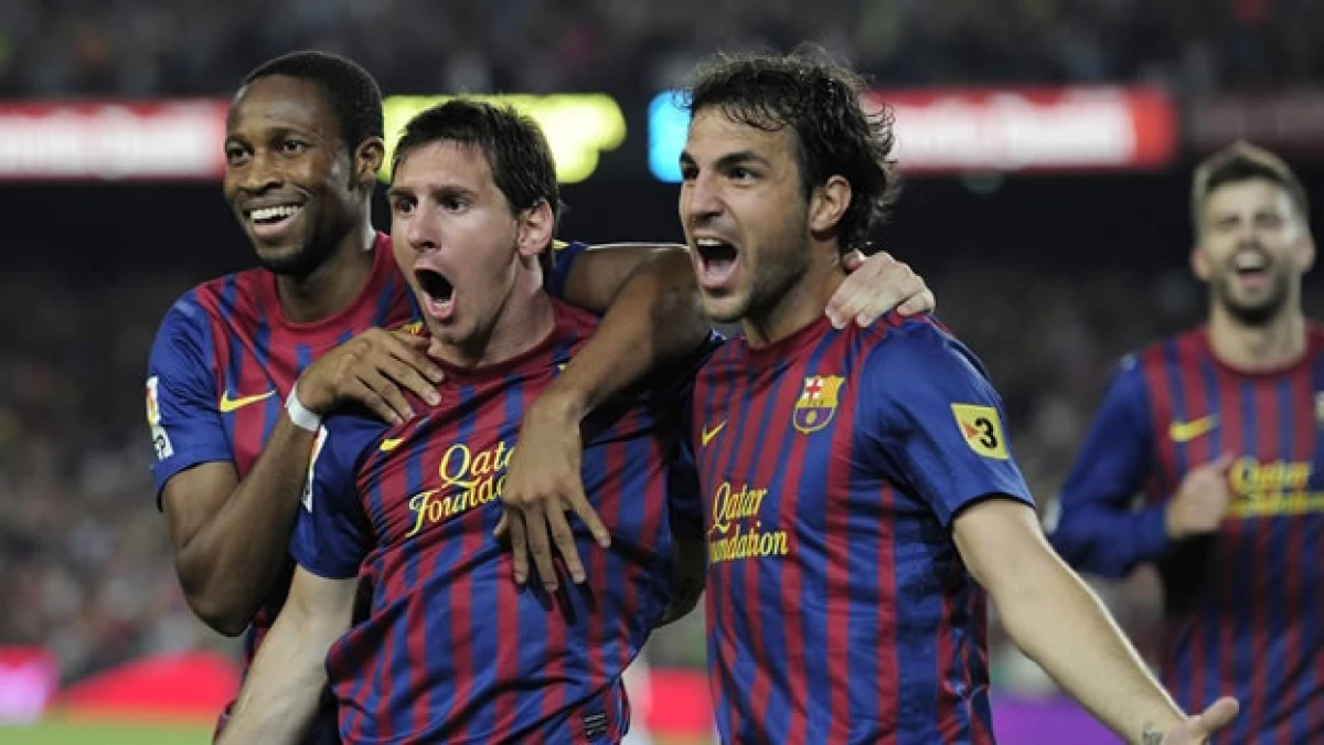 Messi y Fábregas celebran el triunfo del Barcelona