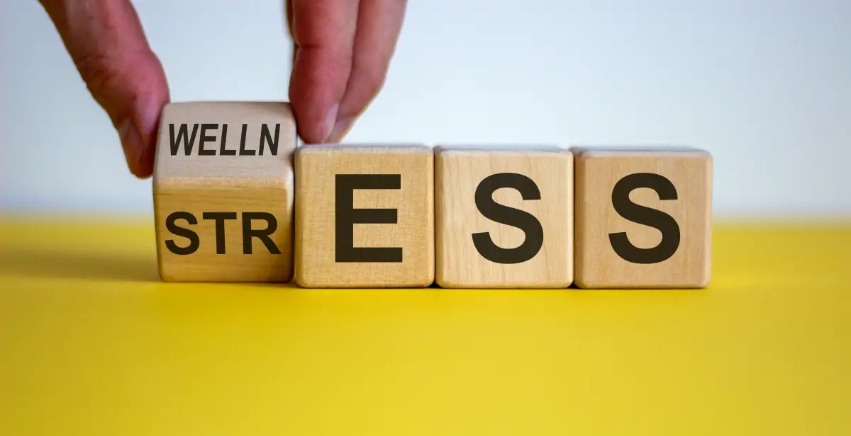 Wellness,Instead,Of,Stress.,Hand,Turns,A,Cube,And,Changes