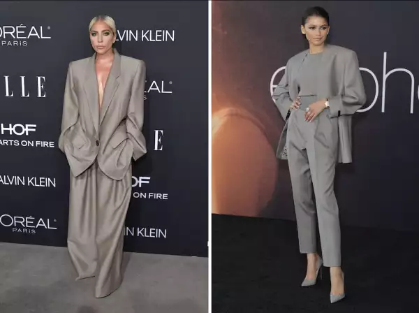 Lady Gaga y Zendaya en traje color gris. 