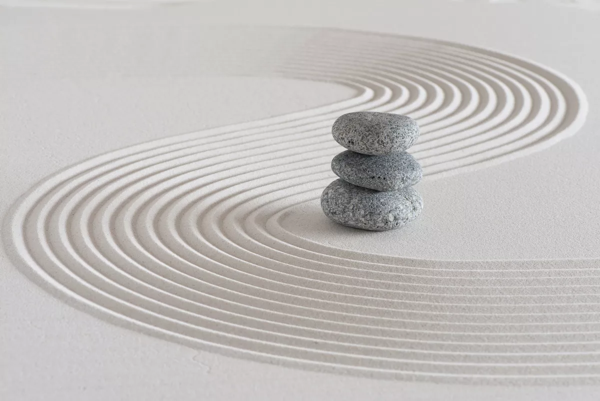 Japanese zen garden with stone in textured sand