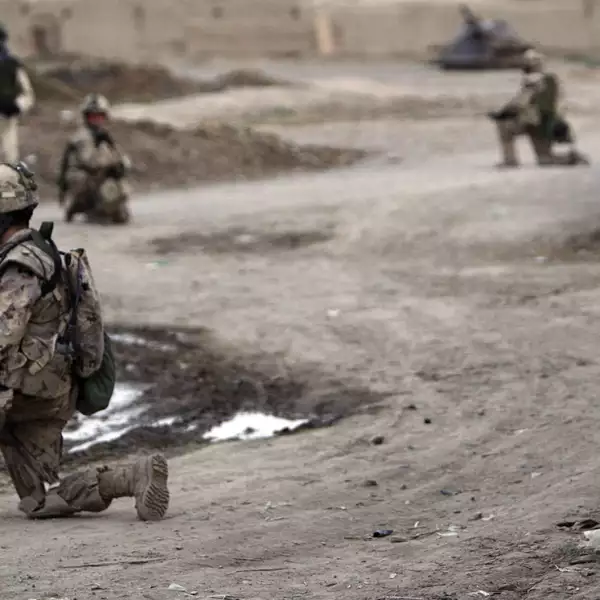 Canadian soldiers of NATO-led coalition take positions during patrol in stronghold of Panjwaii in Kandahar province