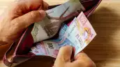 Hand takes money out of wallet, Mexico Peso banknotes, Concept, rising prices, value of Mexican currency