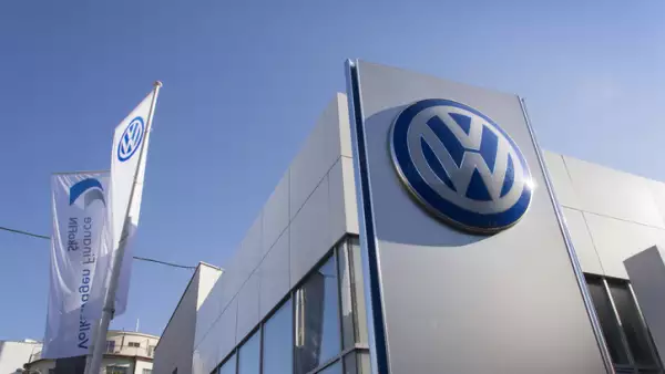 Volkswagen car maker logo on a building of czech dealership