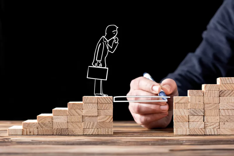 Career Planning Concept. Businessman Getting Help Building Bridges To Success.