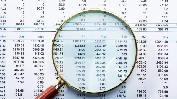 Magnifying Glass On Financial Report