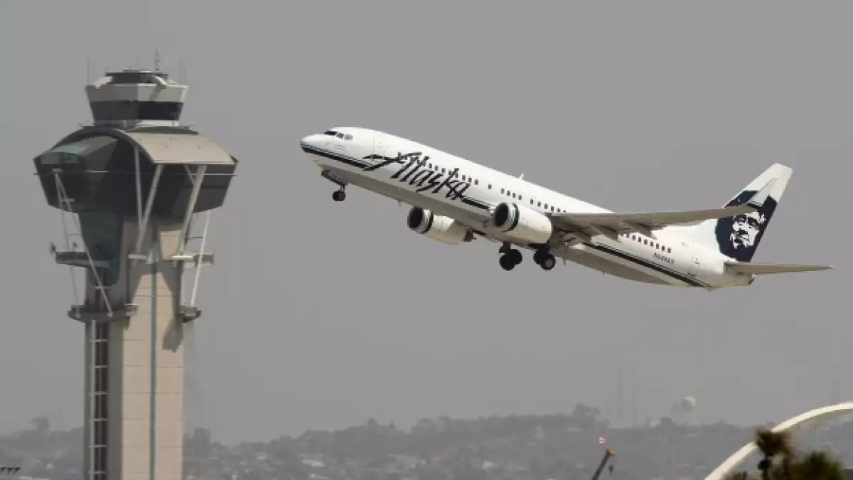 avion alaska airlines mujer con cancer