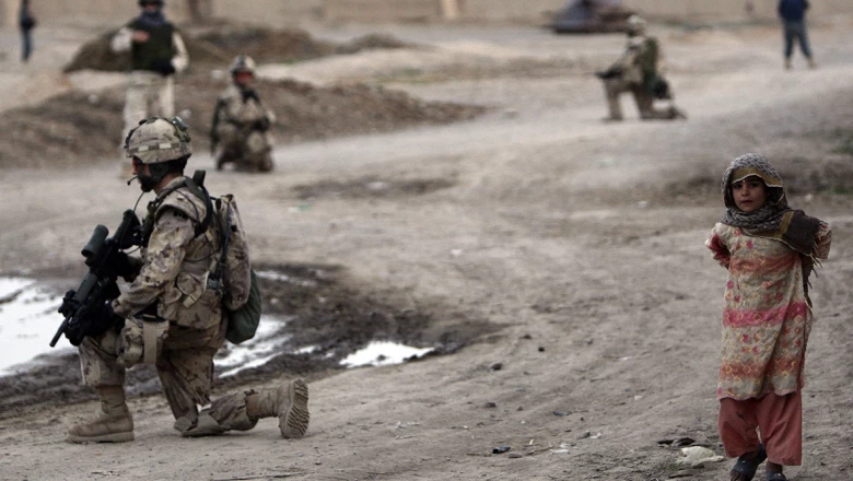 Canadian soldiers of NATO-led coalition take positions during patrol in stronghold of Panjwaii in Kandahar province