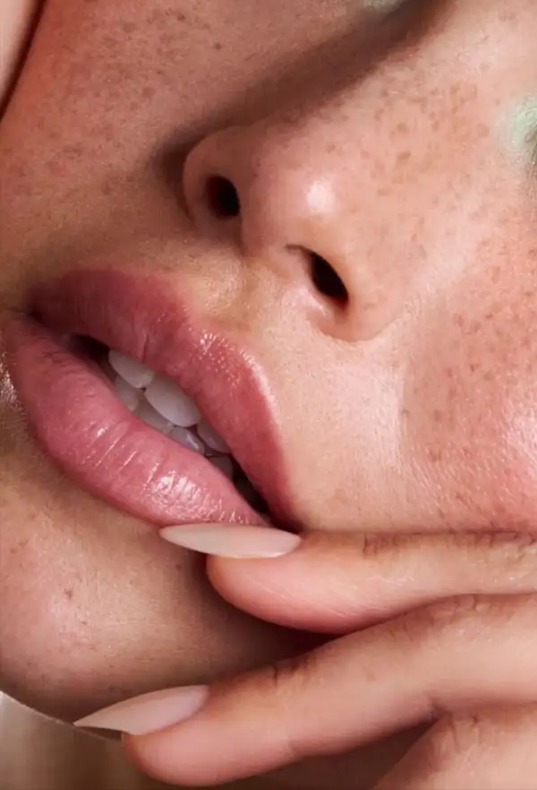 Beautiful,Young,Woman,With,Freckles,And,Long,Smooth,Black,Hair