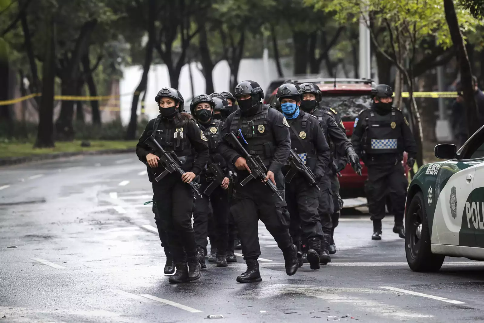 Police officers arrive at the area where a shooting took place in Mexico City