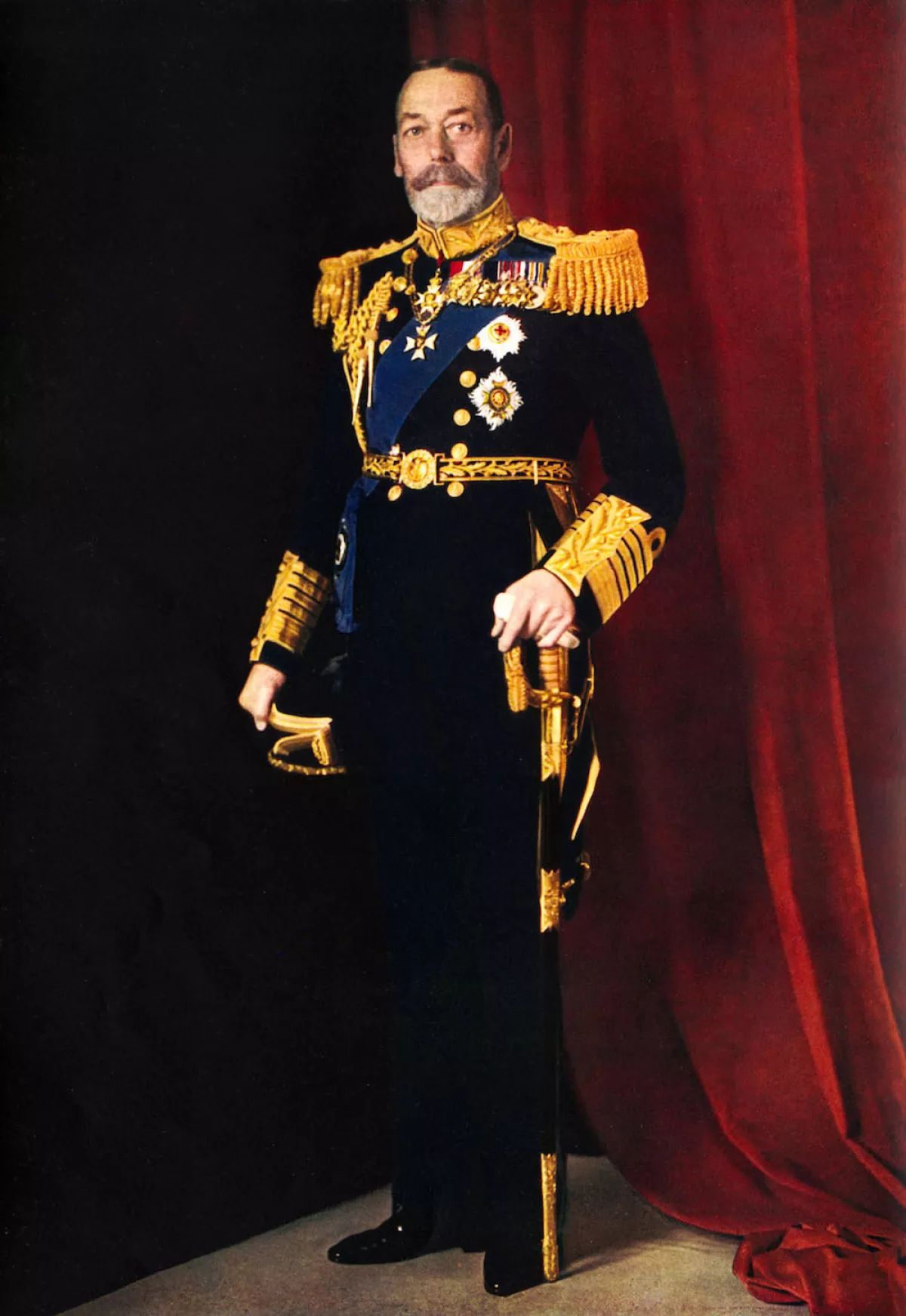 King George V, official portrait photograph of 1935, in full dress uniform with sword.  Illustrated London News Silver Jubilee.  Colour photograph by Finlay Colour Ltd.