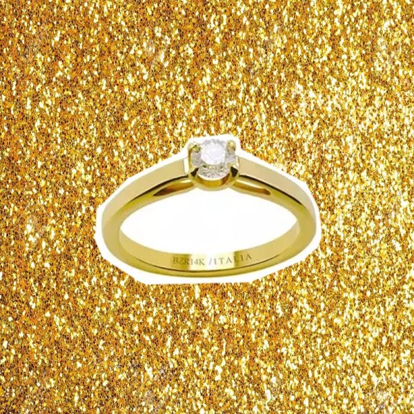 Sprinkle glitter gold dust on a black background with copy space