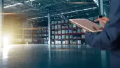 Businessman manager using tablet check and control for workers with Modern Trade warehouse logistics. Industry 5.0 concept