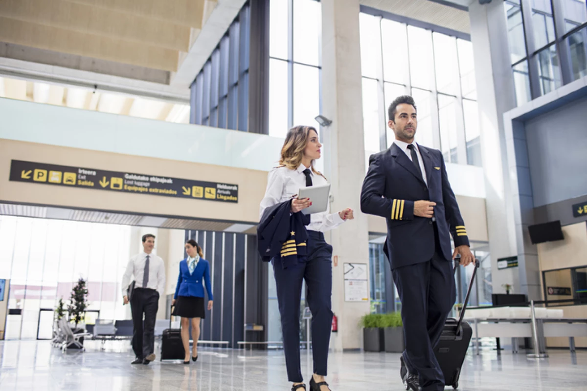 Pilots and flight attendants walking at the airport
