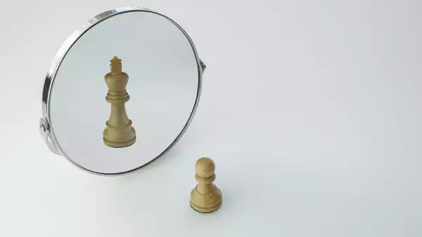 Chess Pawn imagining itself as a King,  pawn in a Mirror being a king