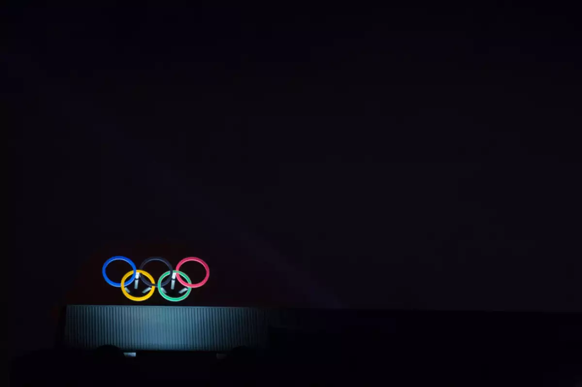 Olympic symbol (also known as Olympic Rings) seen on the Montreal olympic Committee building lit during a dark night. Montreal became an olympic city with the 1976 Summer Olympic Games
