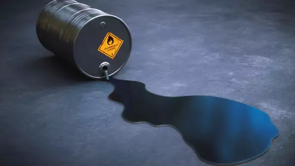 Leaking oil barrel spilling gasoline on the ground