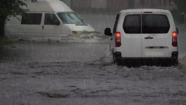 Motion Cars on a flooded city road at the rain day