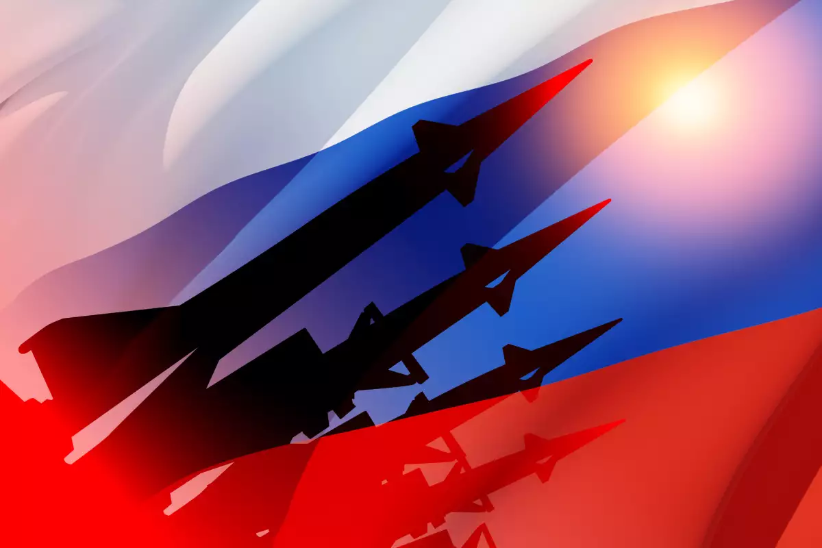 Silhouette of missiles on a background of the flag of Russia and the sun. Nuclear weapon concept.